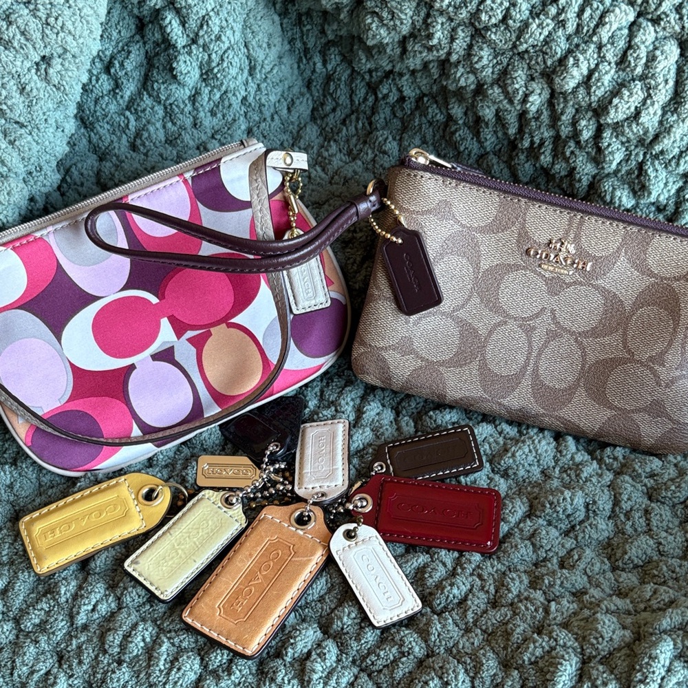 Two coach wristlets and bundle of tags